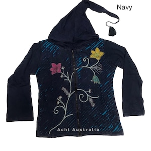 May include: Navy blue hooded jacket with a floral design and a zip closure. The jacket has a long hood with a tassel. The text "Achi Australia" is printed on the bottom of the jacket.
