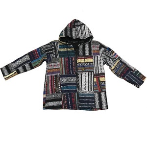 May include: A hooded patchwork jacket with a variety of geometric patterns in blue, black, red, and white. The jacket has a zip closure and a drawstring hood. The text "Kathmandu Store" is visible on the hood.