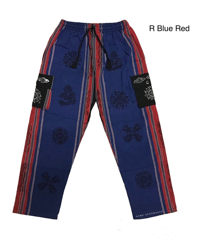 May include: Blue and red striped pants with black patterned designs. The pants have two black pockets with a silver eye design. The text "R Blue Red" is in the upper right corner of the image. The text "ACHI AUSTRALIA" is on the bottom right leg of the pants.