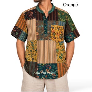 May include: A short-sleeved patchwork shirt featuring a mandarin collar, a three-button placket, and a chest pocket. The fabric displays a mix of orange, green, and brown panels with mushroom and floral patterns alongside striped sections. Text reads Orange and Achi Australia.