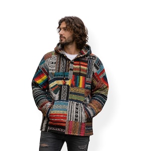 May include: A multi-coloured patchwork hooded jacket with a front pocket and drawstring. The jacket's design incorporates a mix of geometric and striped patterns in shades of red, blue, green, and yellow. The jacket is made of various fabric patches.
