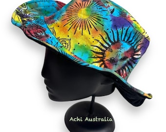 May include: A colorful tie-dye bucket hat with a sun and mandala design. The hat is made of cotton and has a black brim.