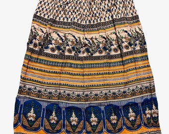 May include: A long, flowing skirt with a vibrant, patterned design. The skirt features a mix of cream, blue, yellow, and brown colors with floral and paisley motifs. The waistline has a drawstring. The text "#01" is in the upper right corner.