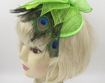 Green fascinator hatinator with peacock feathers,on a comb and elastic, weddings, races, prom