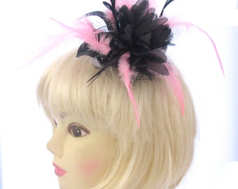 Black and pink flower and feather fascinator comb , weddings, races ,ladies day Ascot