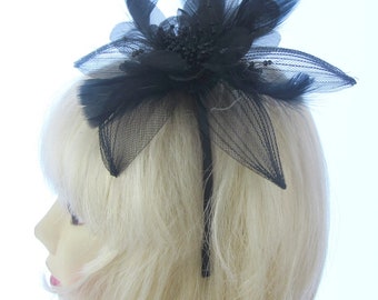 Black net and feather with netting  fascinator headband,weddings, races,prom