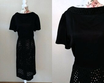 vintage 1960s black wiggle dress with see-through circle pattern