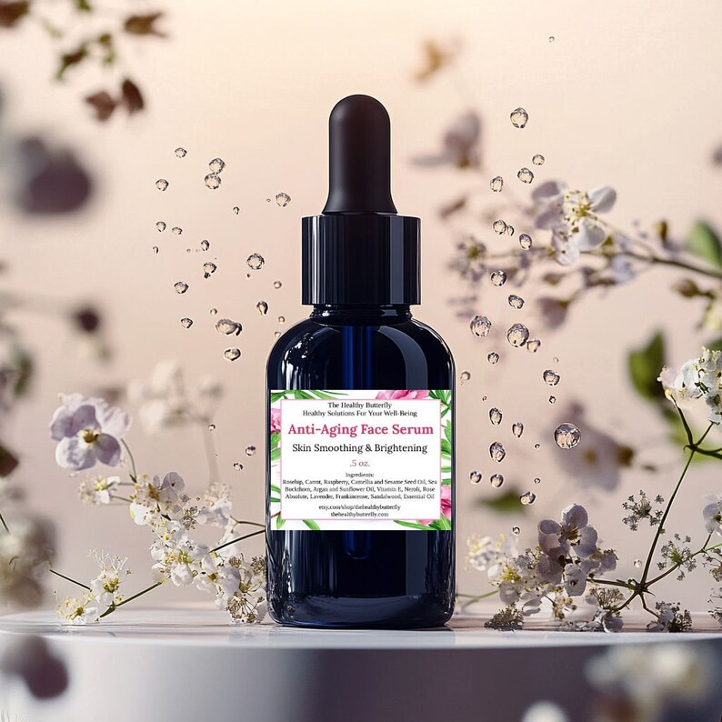 May include: A dark blue glass bottle of anti-aging face serum with a black dropper. The label reads "Anti-Aging Face Serum" and "Skin Smoothing & Brightening". The bottle is surrounded by white flowers and water droplets.