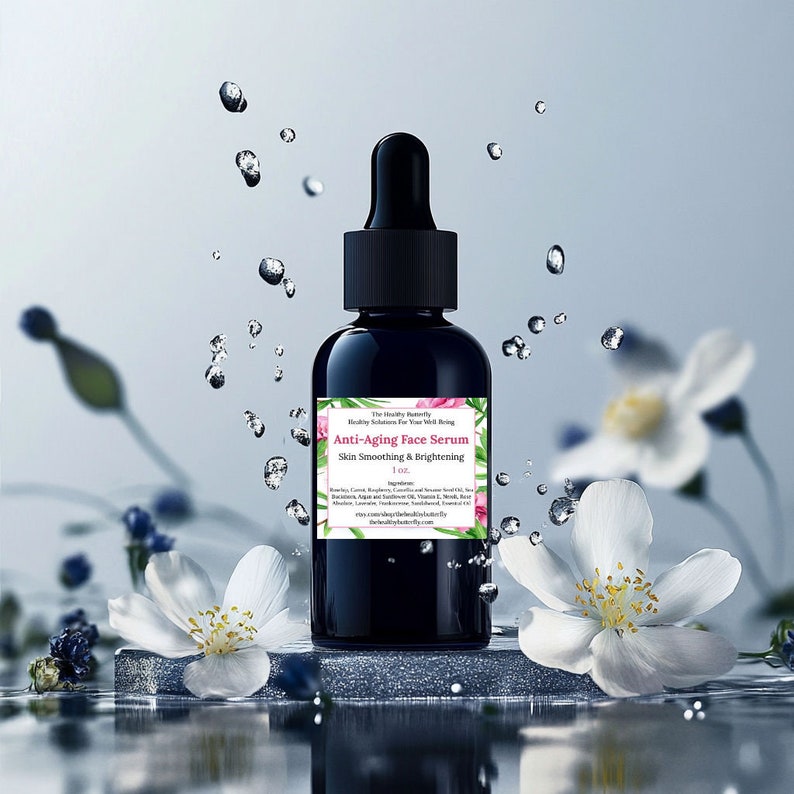 May include: A dark blue glass bottle with a black dropper cap, labeled "Anti-Aging Face Serum." The label includes text about skin smoothing and brightening, with floral accents. The bottle is 1 oz. in size. Water droplets and white flowers surround the bottle.