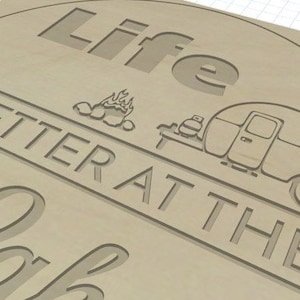 May include: A wooden sign with the text "Life is better at the lake" in a cursive font. The sign also features a campfire, a camper, and a heart.