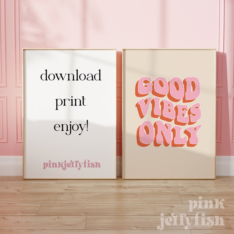 May include: Two printable posters with a light beige background. The poster on the left has the text "download, print, enjoy!" and the text "pinkjellyfish" in a pink font. The poster on the right has the text "GOOD VIBES ONLY" in a pink and orange font.
