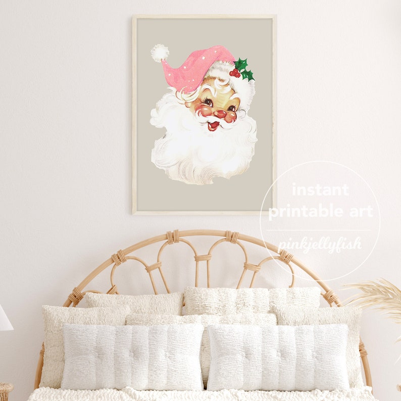 May include: A printable art print featuring a vintage illustration of Santa Claus with a pink hat and a white beard. The background is a light beige colour.