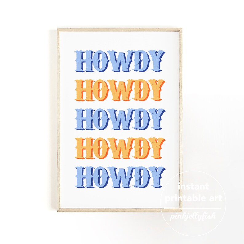 May include: A framed print featuring the word "HOWDY" in a repeating pattern of blue and orange. The text is in a bold, vintage style, set against a white background. The frame is a light wood color.