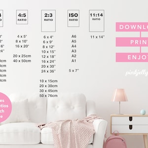 May include: A white couch with a pink throw blanket in a room with a white wall. The wall has a pink sign that says "DOWNLOAD", "PRINT", and "ENJOY!" with the text "pinkjellyfish" below. The wall also has a chart with different aspect ratios and their corresponding measurements in inches and centimeters.