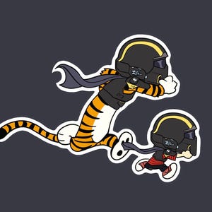May include: Two cartoon figures, a tiger and a child, are depicted in a dynamic pose, wearing black helmets with yellow stripes and capes. The tiger has orange and black stripes. The child is wearing a black jacket and red pants.