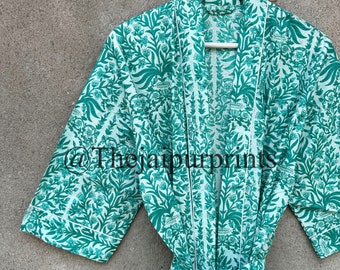 May include: A green and white floral print robe hanging on a white hanger. The robe has a tie closure and a white trim. The text "@Thejaipurprints" is visible on the left side of the robe.
