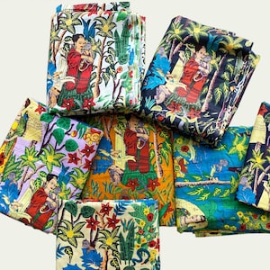 May include: A set of eight fabric squares featuring a colourful, repeating pattern of a woman in a jungle setting. The woman is depicted in a red dress and holding a bird. The fabric squares are in various colours, including blue, green, yellow, orange, and purple.