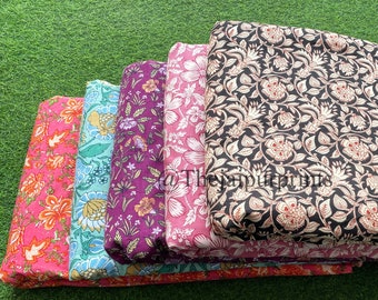 May include: A stack of five fabric panels with floral patterns. The top panel is black with white and red floral designs. The other panels are pink, purple, blue, and orange with various floral patterns.