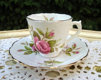 Demitasse white teacup with pink roses