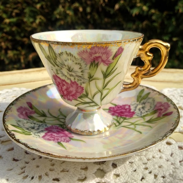 Lovely little lusterware vintage teacup and saucer decorated with pink flowers