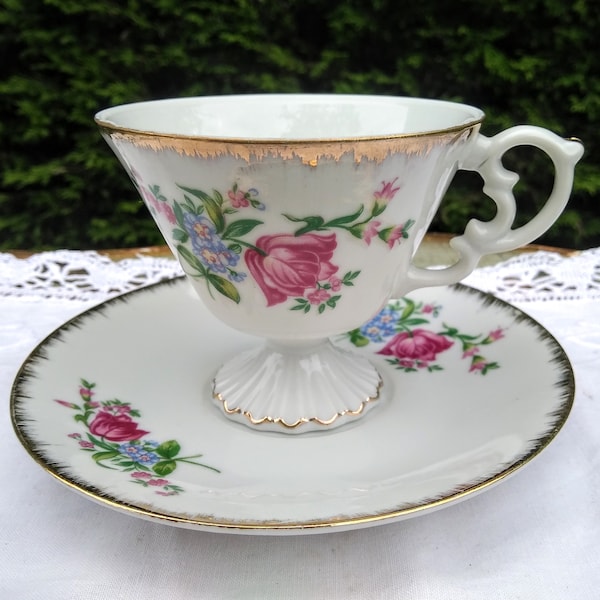 Large footed teacup decorated with flowers