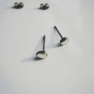 Rocks 02. Oxidized sterling silver post earrings . Small polished faceted stud earrings , suitable for everyday wear