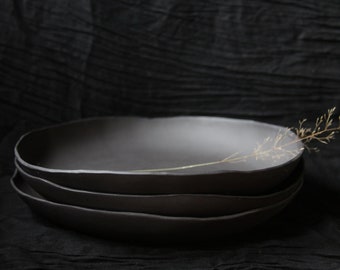 Ceramic plate unglazed grey-black anthracite organic purist modern minimalist