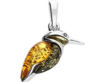 May include: A silver pendant featuring a detailed bird design with amber and green inclusions. The bird's body is made of amber, with a green head and beak. The pendant is perfect for nature lovers and those who appreciate unique jewelry.