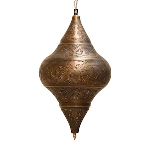 May include: A bronze-colored, hanging pendant lamp with an intricate, pierced design. The lamp has a teardrop shape with a pointed bottom and a decorative top. The metal is a warm, antique bronze color, and the pierced pattern allows light to filter through.