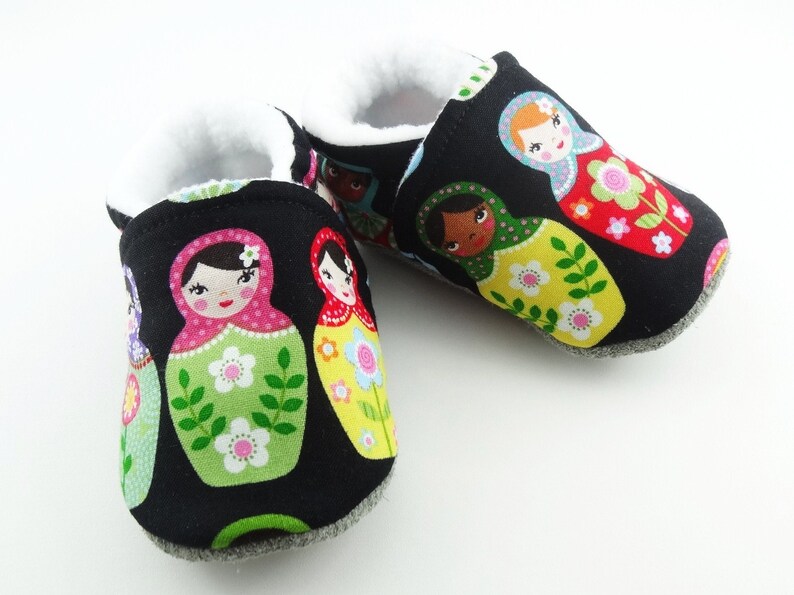 Baby leather sole and black cotton top shoes with matriochkas ideal for a birth gift