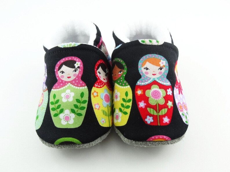 Baby leather sole and black cotton top shoes with matriochkas ideal for a birth gift