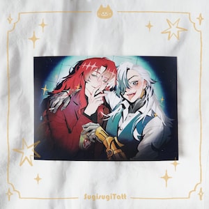 May include: A print depicting two anime-style figures. One has red hair and a red jacket, the other has white hair and a blue vest. The print is on a white background with gold star and cat illustrations. The text "SugisugiTatt" is at the bottom.