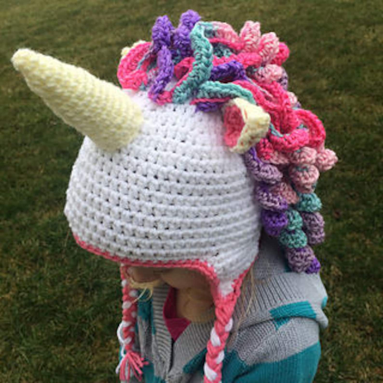 Crochet Unicorn Hat Pattern Crochet unicorn hat with rainbow mane, pastel colors, and magical horn, adorable handmade gift for kids and unicorn lovers.