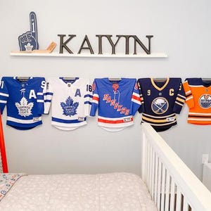 wall decor, decor, home decor, kids room, childrens room, hanger, display, jersey hanger, jersey display, jersey frame, kids room ideas