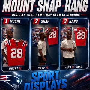 May include: A promotional image for Sport Displays, featuring a step-by-step guide to mounting a jersey. The image shows a red and white jersey with the number 28. The text reads "Mount, Snap, Hang" and "Display your game-day gear in seconds."