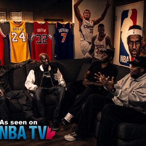 May include: A group of men seated on a dark gray sofa, with basketball jerseys hanging on the wall behind them. The jerseys are red, yellow, and blue, with player names and numbers. The NBA logo and "As seen on NBA TV" are visible.