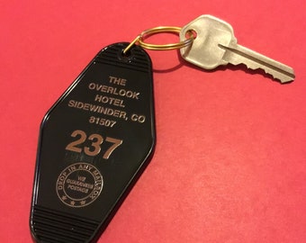 The  Overlook Hotel Room #237 In Key Tag Inspired By The Shining.Black Key Tag With Metallic Gold Imprint And A Gold Colored Key Ring.
