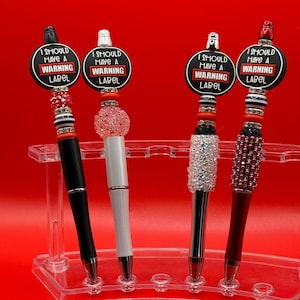 Etiqueta de advertencia Bolígrafo con cuentas brillantes