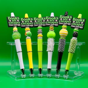 Les livres sont moins chers que le stylo bling bling avec perles et perles Therapy