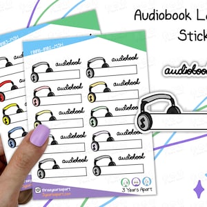 May include: A sheet of sticker labels featuring a black and white illustration of headphones with a music note. The stickers are designed for labelling audiobooks and have a blank space for writing the title. The sheet includes the text "Audiobook Label Stickers" and "3 Years Apart".