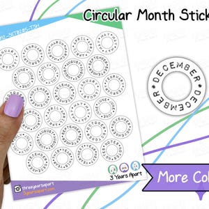 May include: Sheet of circular month stickers with black text on a white background. Each sticker has a month name around the edge. The text "Circular Month Stickers" is at the top. The text "More Colors" is in a purple banner.