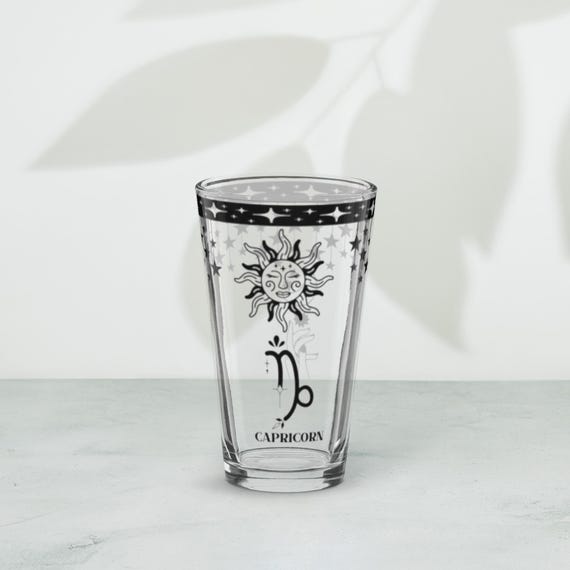 Capricorn Zodiac Pint Glass with Celestial Sun and Moon Design