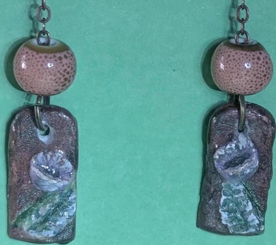 Peeking Flower: Hand-carved and painted clay and resin earrings. Handmade jewelry. Bronze tone drop earrings.