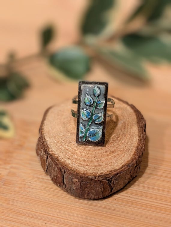 Sprig: Handmade jewelry- carved and painted clay and resin statement ring.Soft green, blue, & white. Silver tone, stainless alloy.