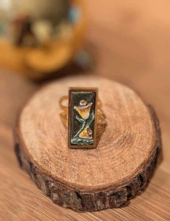 Awakening spring: Hand-carved and painted clay and resin statement ring. Handmade jewelry. Yellow, orange, green, goldtone, stainless alloy.