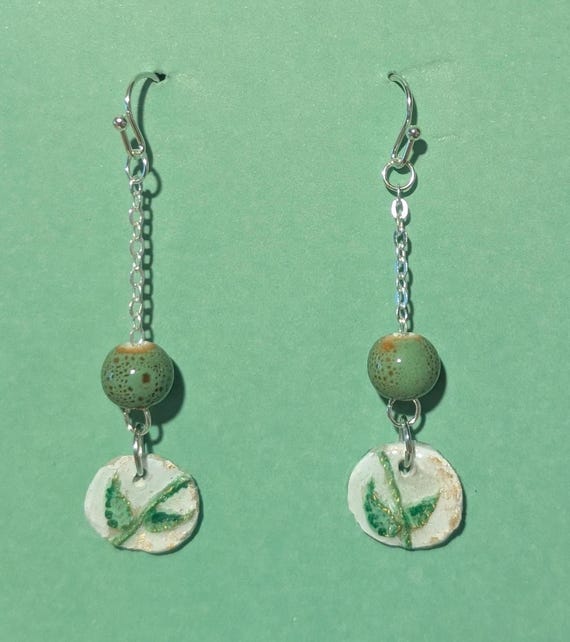 Green leaves: Hand-carved and painted clay and resin earrings. Handmade jewelry. Silvertone drop earrings.
