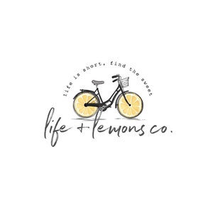 May include: Black bicycle with lemon slices for wheels. The text "life is short, find the sweet life + lemons co." is written around the bicycle.