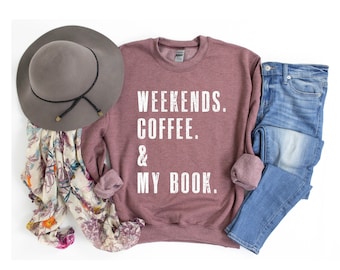 May include: A maroon sweatshirt with the text "Weekends. Coffee. & My Book." in white.