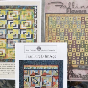 May include: Three quilt pattern covers are displayed. The patterns include geometric designs in shades of yellow, blue, and brown. The text on the covers reads "Modern Greek Shadows", "Falling Flowers", and "FractureD ImAge".