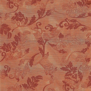 May include: A close-up of a fabric with a repeating floral pattern. The design features stylized leaves and vines in shades of rust and brown against a muted orange background. The fabric has a textured appearance.